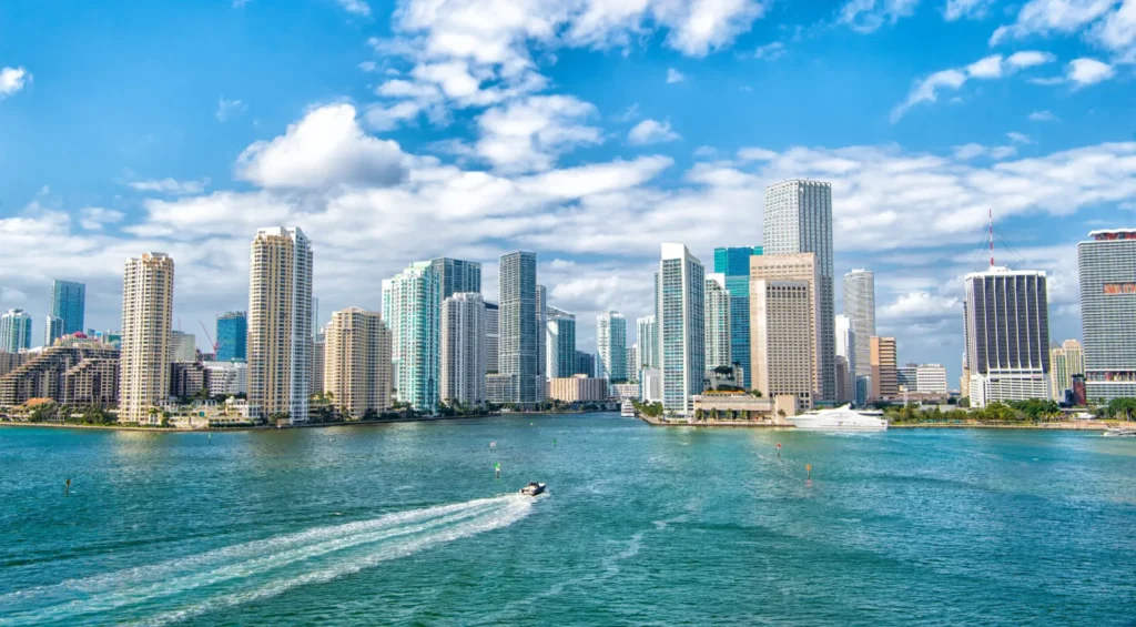 Downtown Miami and Brickell skyline seen across Biscayne Bay on a sunny day